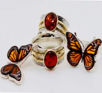 Ring with butterflies and a red center